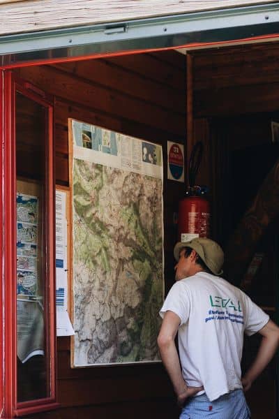 Surveyor analyzing property map - ALTA SURVEY Idaho Surveyor reviewing a large property map and topographic details during survey preparation