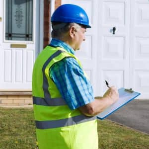 Field land surveyor documenting property measurements - ALTA SURVEY Idaho Licensed land surveyor documenting property measurements for an ALTA title survey